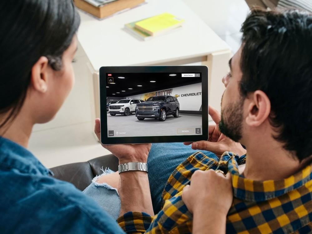 Two adults looking at a tablet