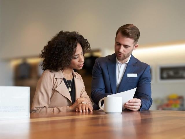 Staff member explaining financing to customer