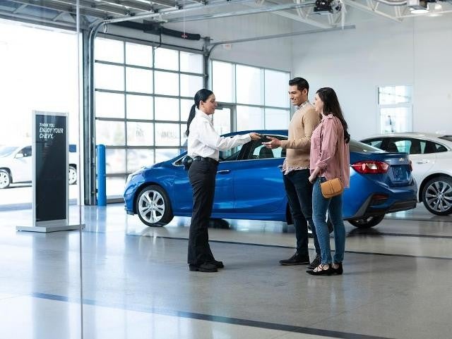 Dealersihp staff speaking with customers